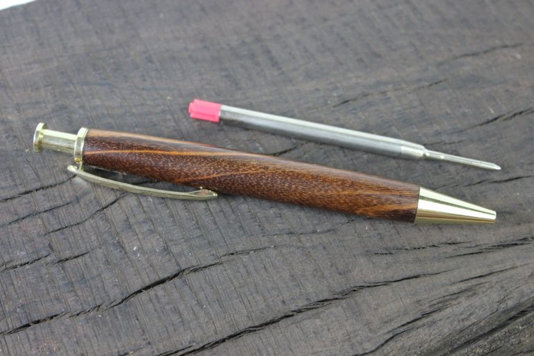 An Artisan Click pen with a parker style refill