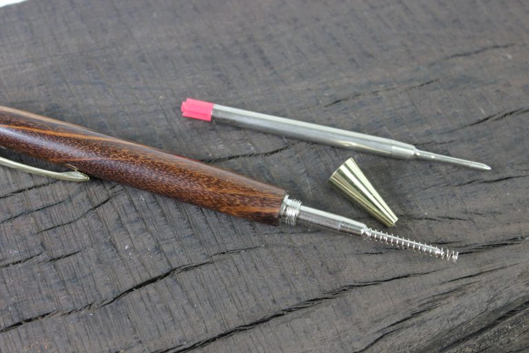 An Artisan Click pen with a parker style refill